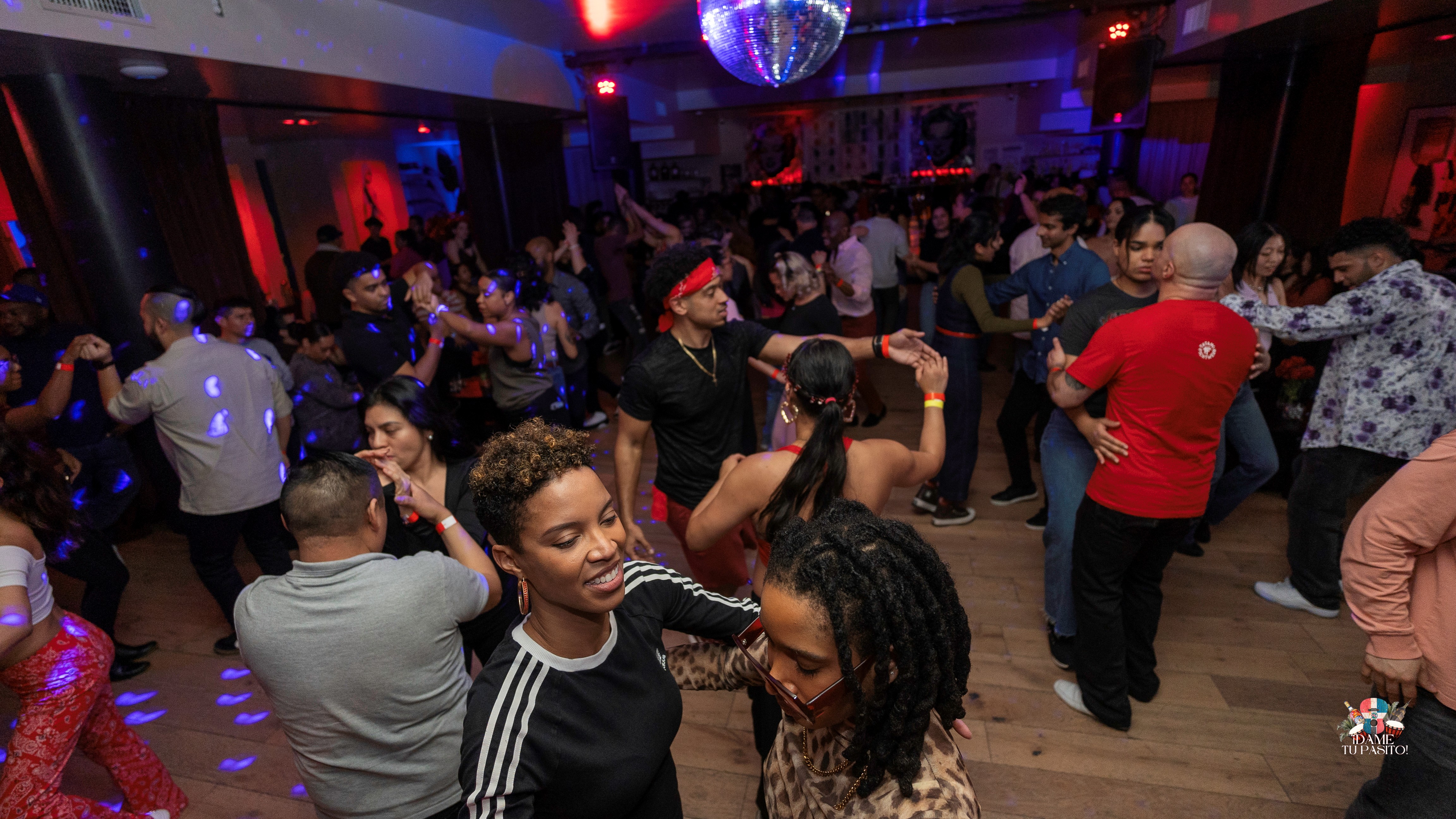 People dancing Bachata on a dance floor. 